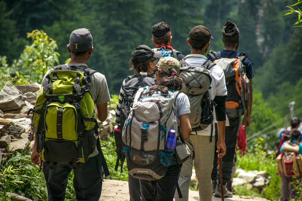 Eco friendly retreat venue | Imagine Greece Retreats An adventurous group hike in a lush forest setting with vibrant green surroundings.